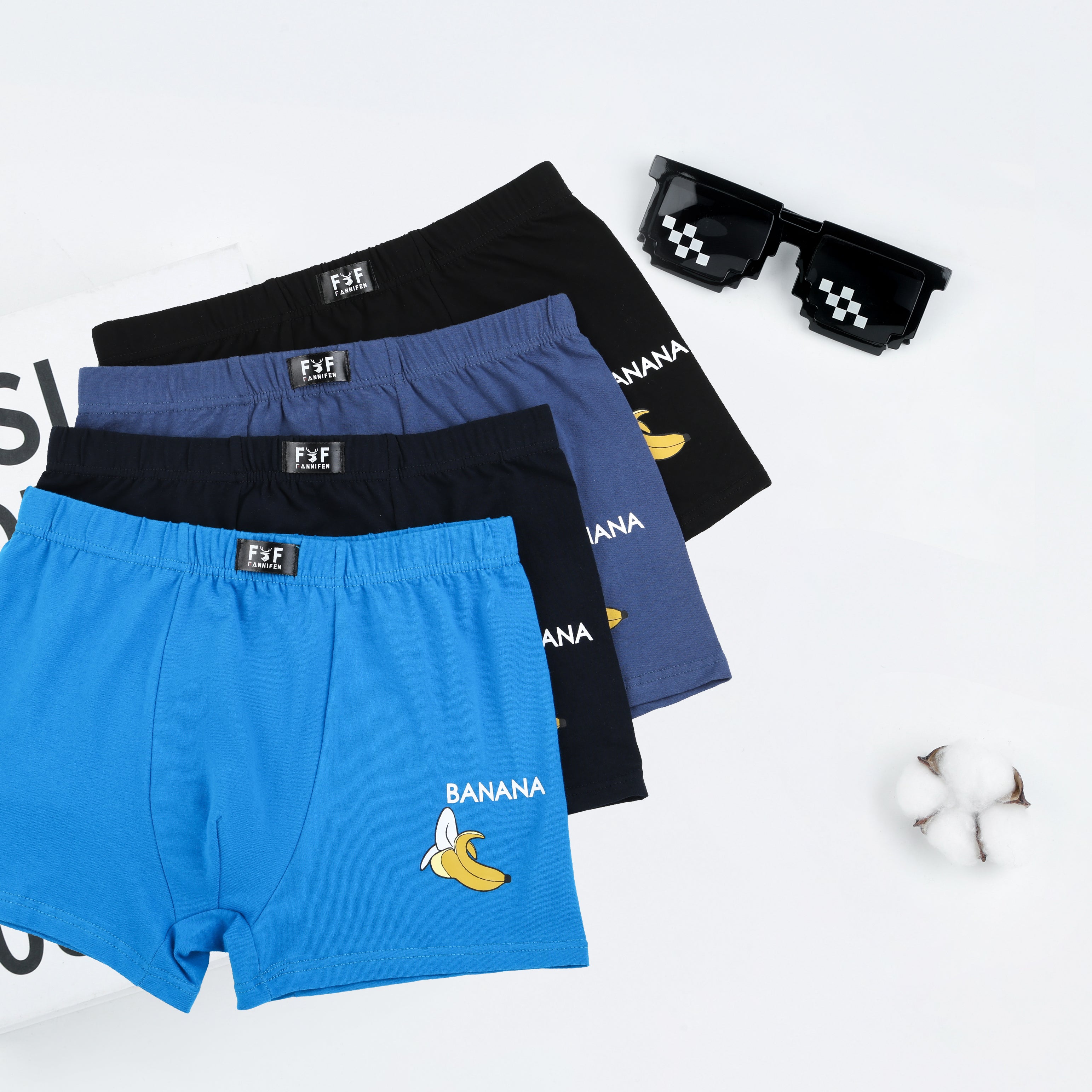 Three pairs of men's boxer briefs in blue, black, and navy on a white background with 'BANANA' branding.